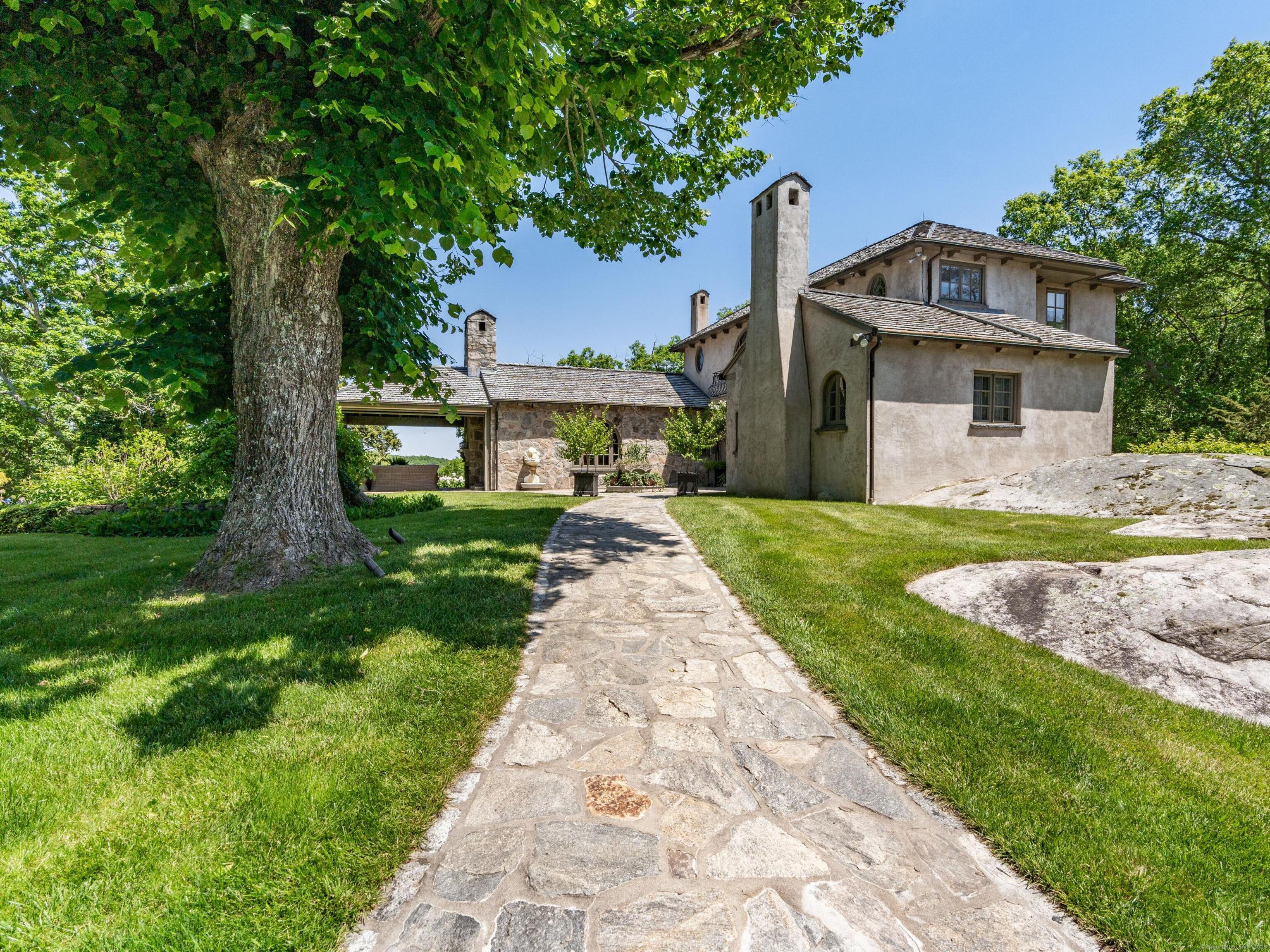 213 Beaver Brook Road Lyme, CT 06371 - Photo 2 of 38 a front view of a house with garden