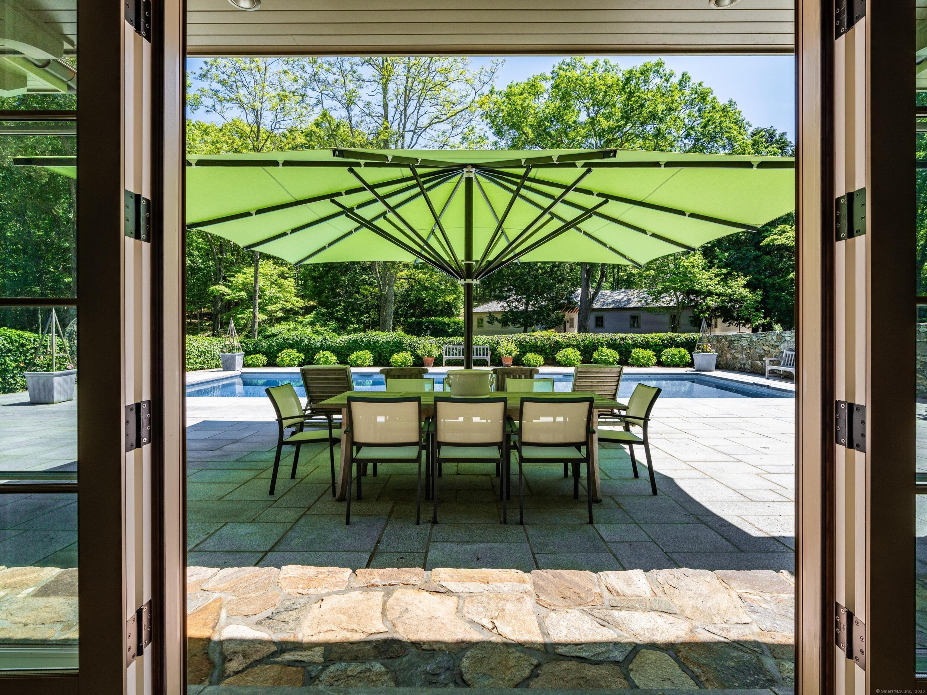 213 Beaver Brook Road Lyme, CT 06371 - Photo 26 of 38 a view of a chairs and table in patio with a yard