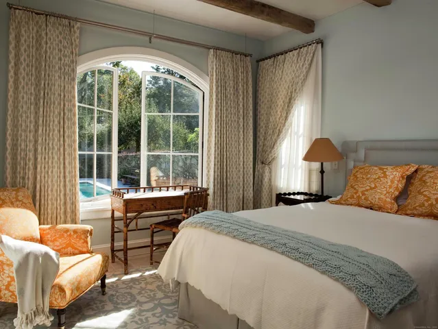 a bed room with a bed and a couch