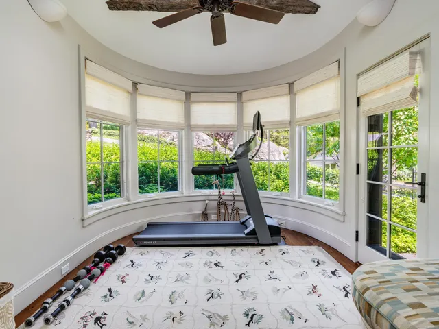 an aerial view of a house with swimming pool garden and patio