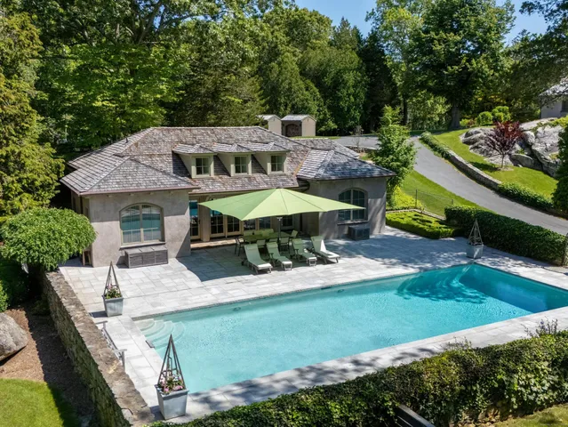 a view of a swimming pool with a patio