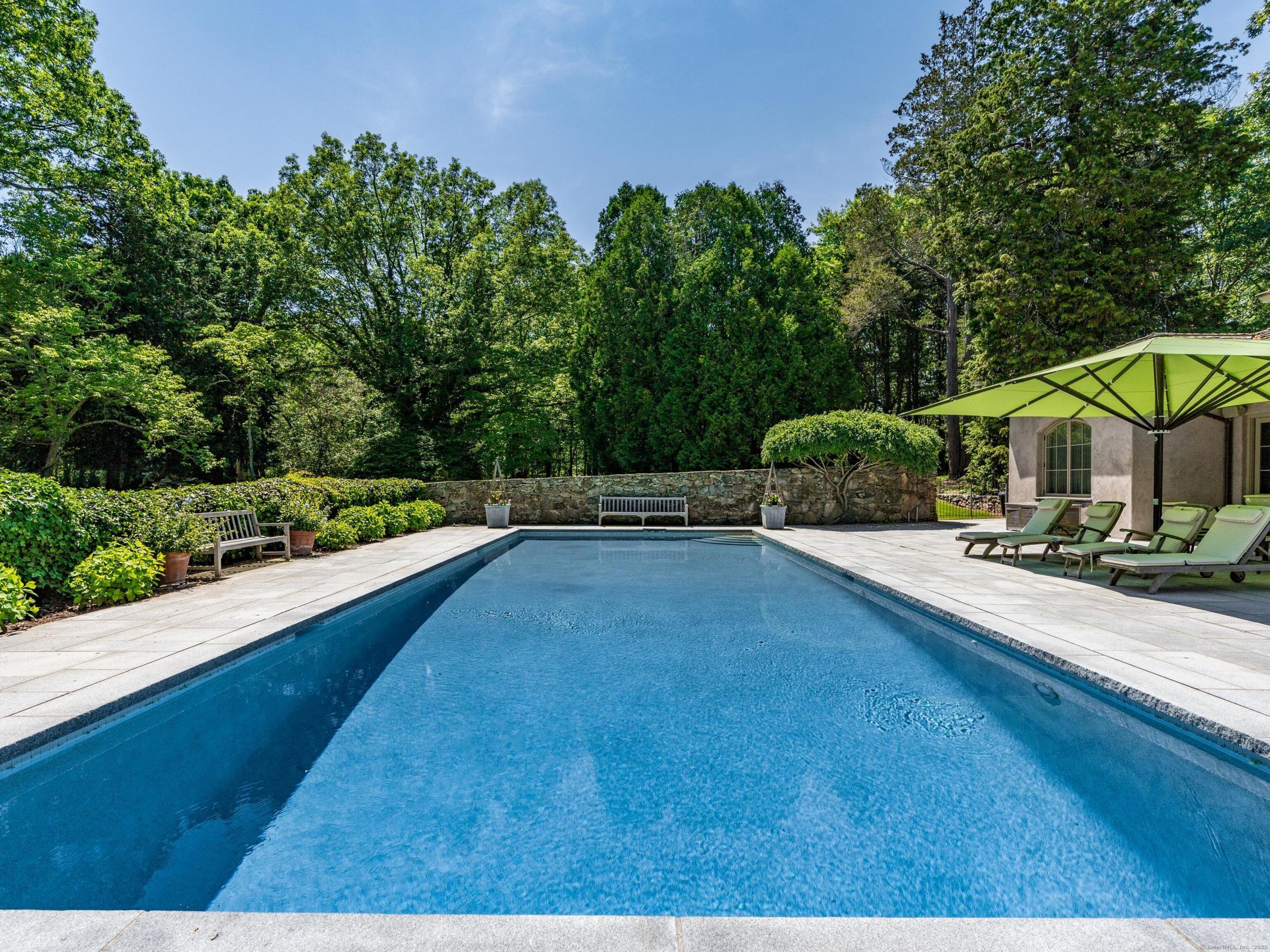 213 Beaver Brook Road Lyme, CT 06371 - Photo 37 of 38 a view of a swimming pool with a patio