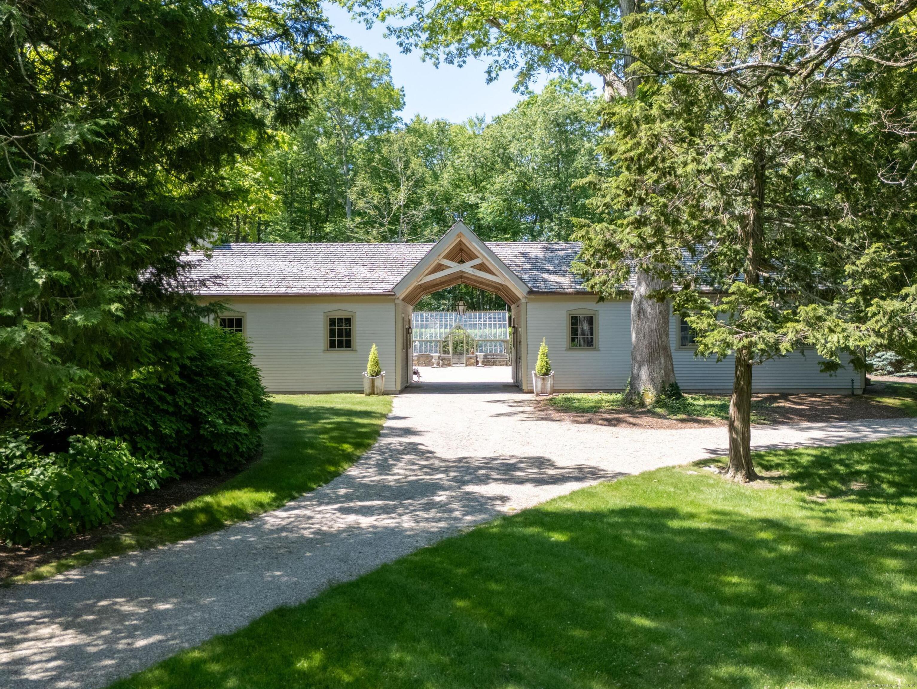 213 Beaver Brook Road Lyme, CT 06371 - Photo 38 of 38 a front view of a house with a garden and yard