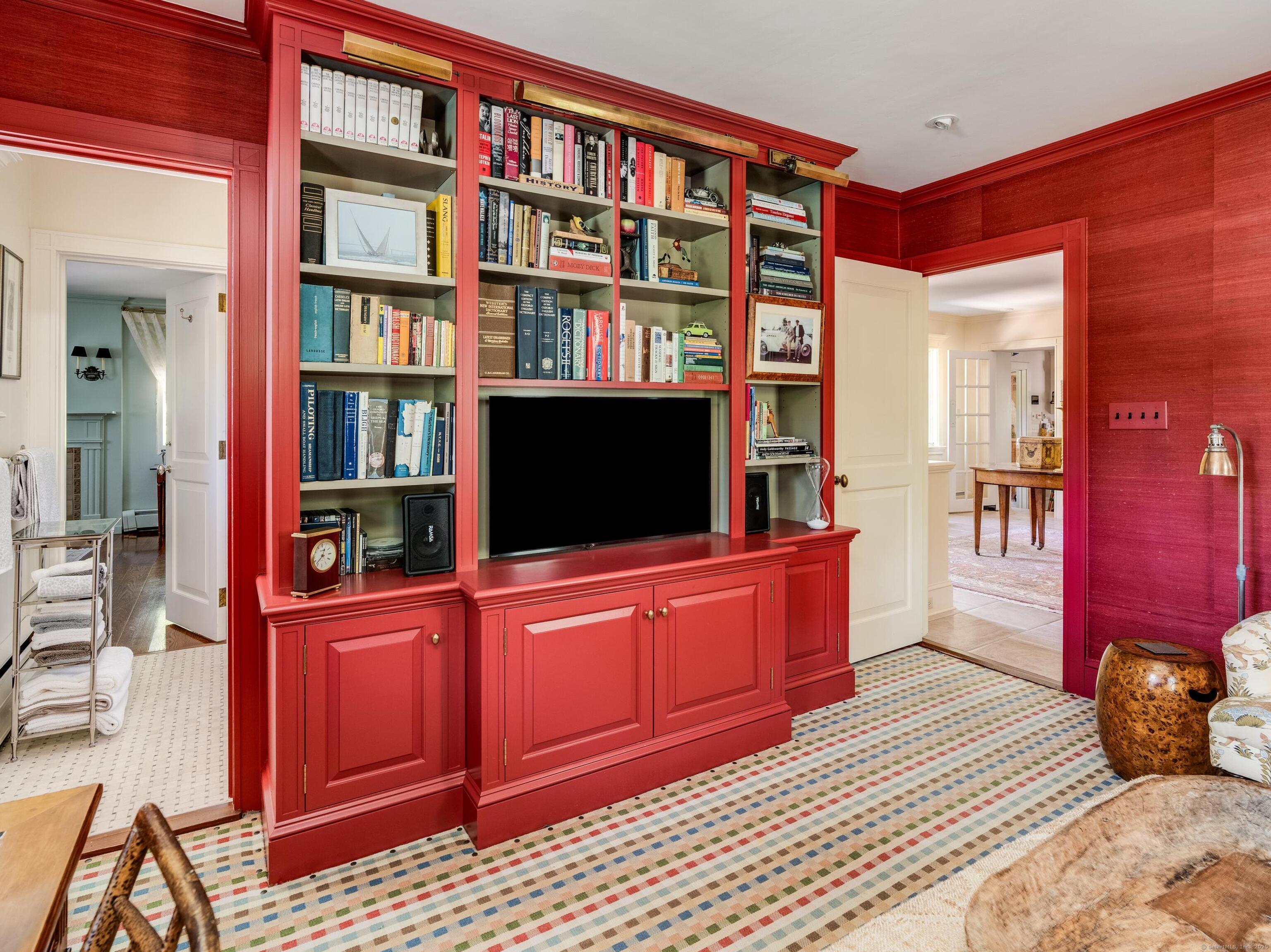 213 Beaver Brook Road Lyme, CT 06371 - Photo 9 of 38 a living room with furniture cabinets and a flat screen tv