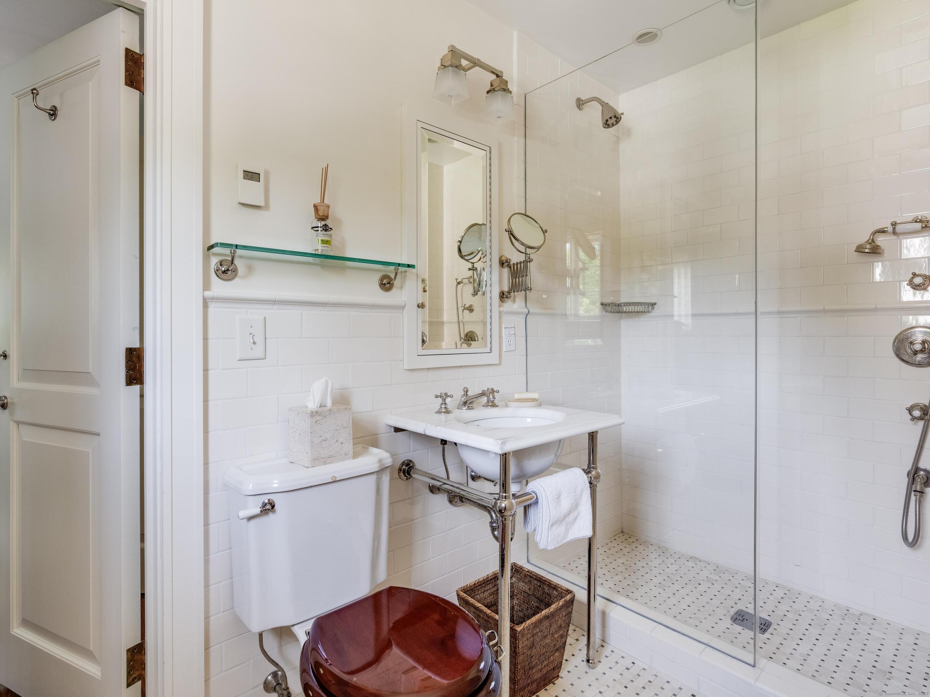 213 Beaver Brook Road Lyme, CT 06371 - Photo 10 of 38 a bathroom with a sink a toilet and shower