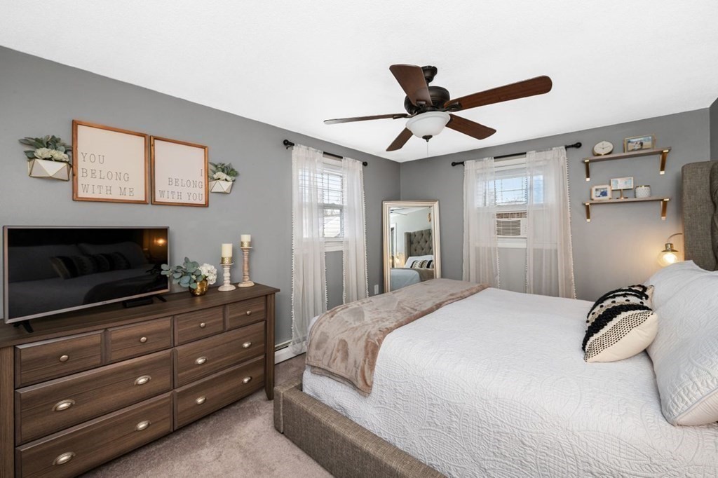 36 Hally Road Lowell, MA 01854 - Photo 13 of 33 a bedroom with a bed and a flat screen tv