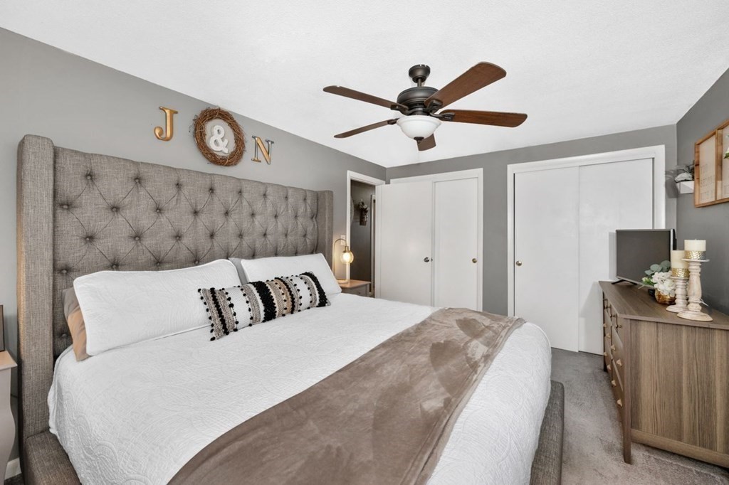 36 Hally Road Lowell, MA 01854 - Photo 14 of 33 a bedroom with a large bed and a ceiling fan