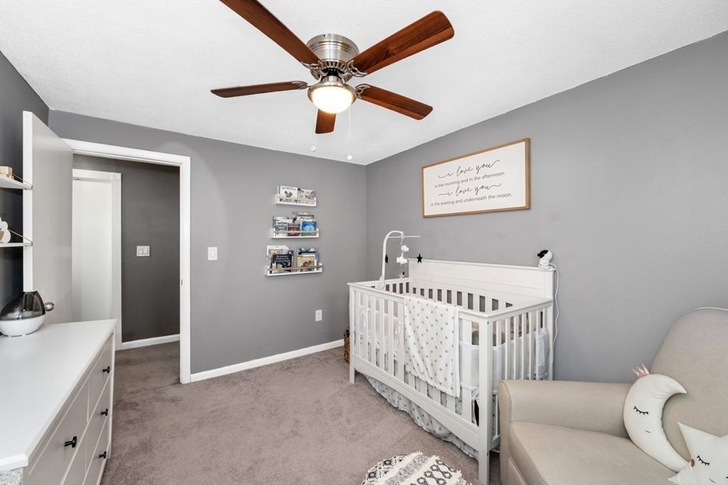 36 Hally Road Lowell, MA 01854 - Photo 19 of 33 a bedroom with a bed and a large window