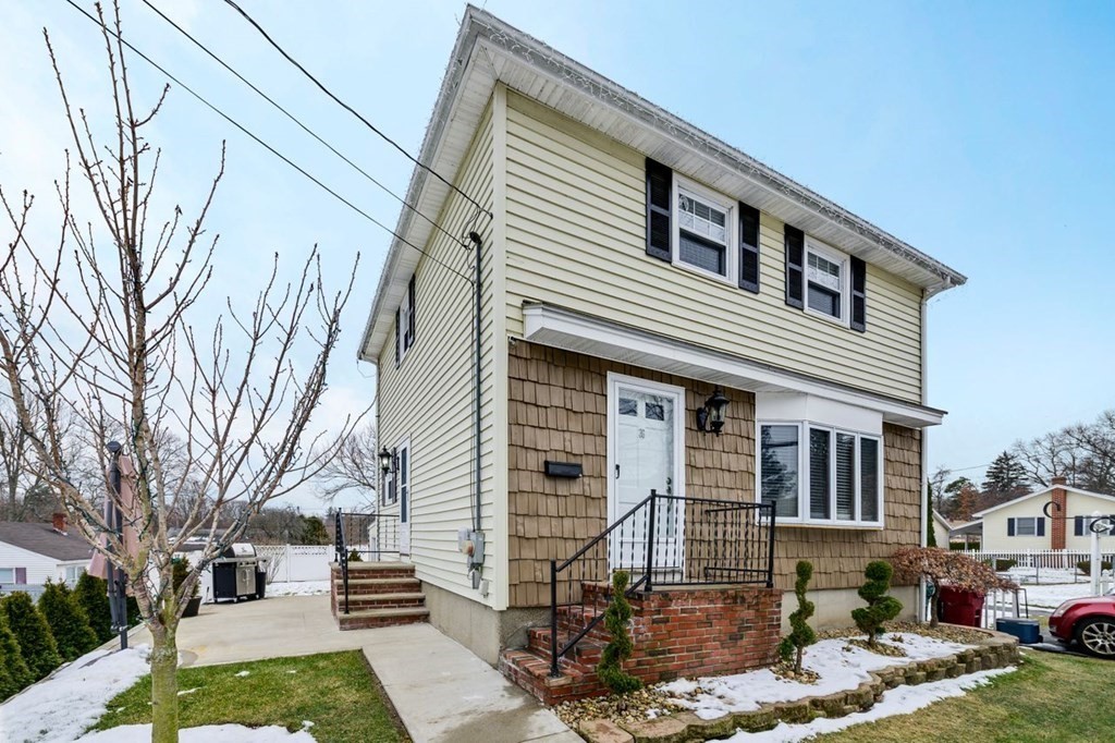 36 Hally Road Lowell, MA 01854 - Photo 2 of 33 a front view of a house with garden