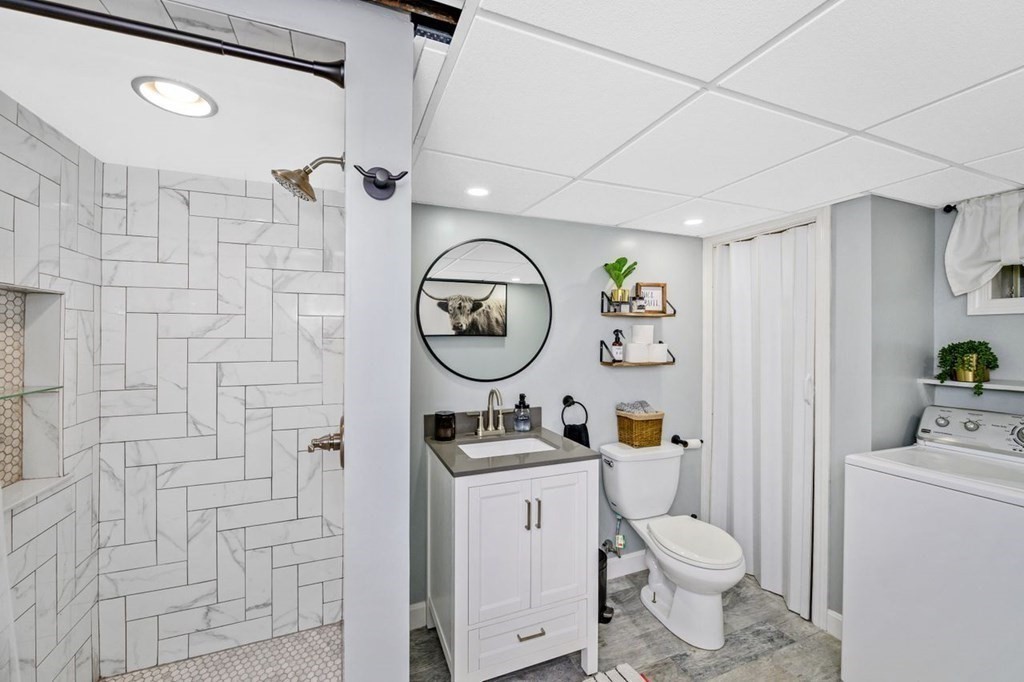 36 Hally Road Lowell, MA 01854 - Photo 21 of 33 a bathroom with a toilet a sink and a shower curtain