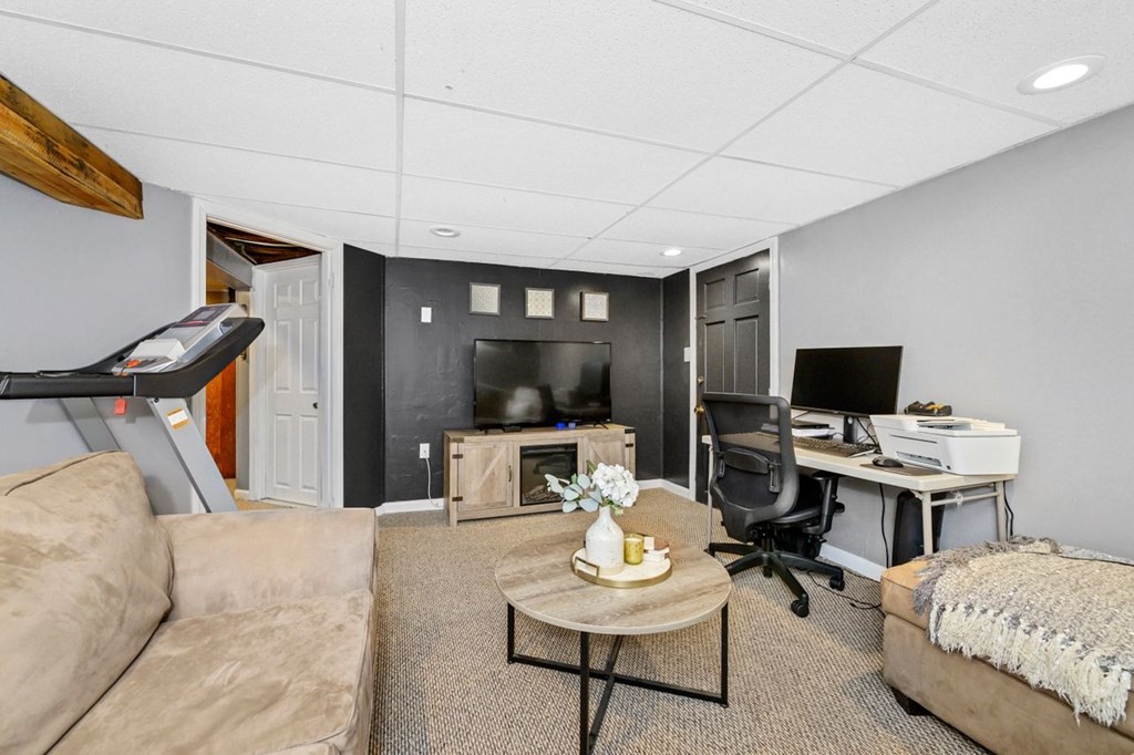 36 Hally Road Lowell, MA 01854 - Photo 23 of 33 a living room with furniture and a flat screen tv