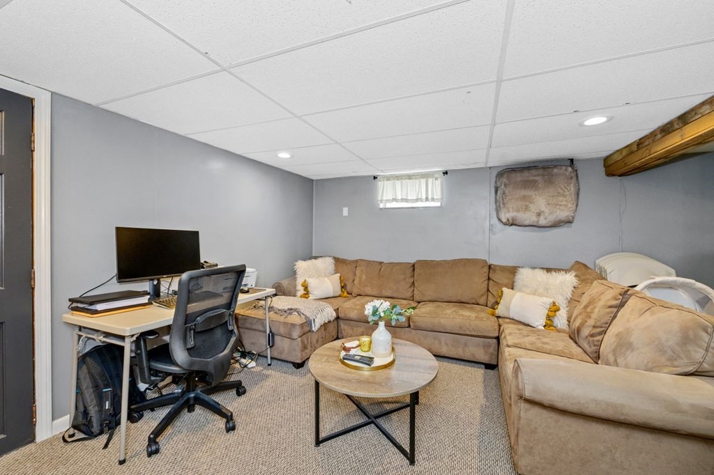 36 Hally Road Lowell, MA 01854 - Photo 24 of 33 a living room with furniture and a laptop