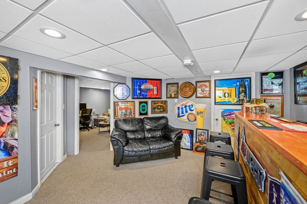 36 Hally Road Lowell, MA 01854 - Photo 25 of 33 a living room with furniture garage and a flat screen tv