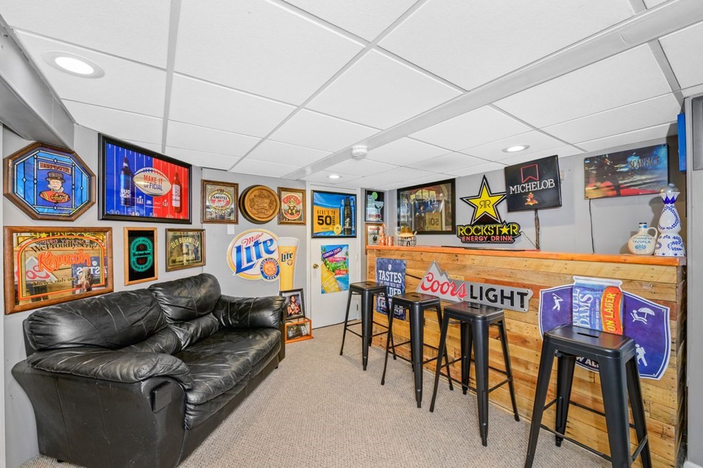 36 Hally Road Lowell, MA 01854 - Photo 26 of 33 a living room with furniture and a flat screen tv