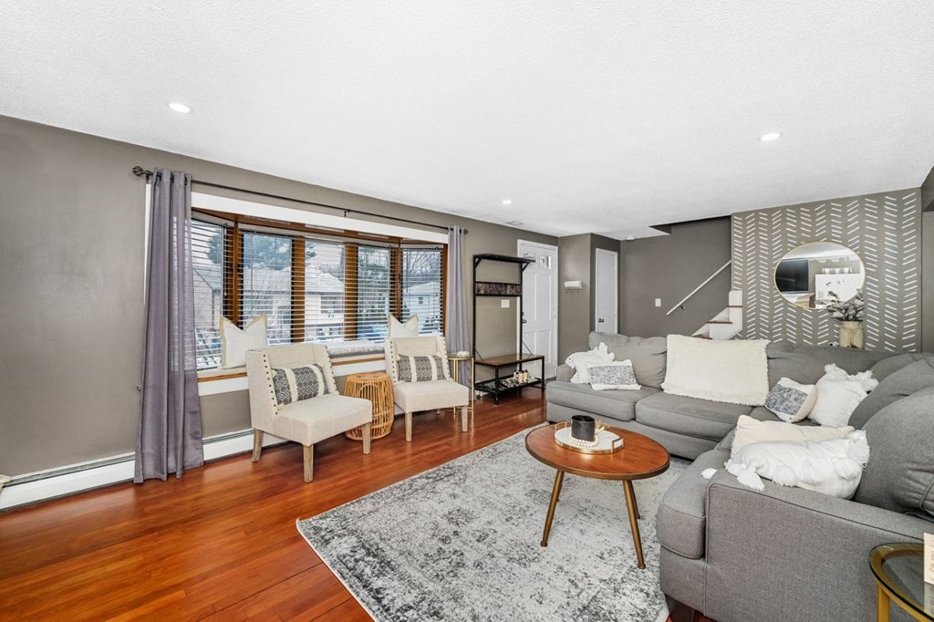 36 Hally Road Lowell, MA 01854 - Photo 7 of 33 a living room with furniture and a wooden floor