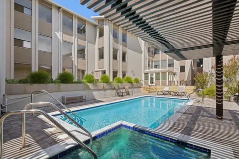 a view of a swimming pool with a patio