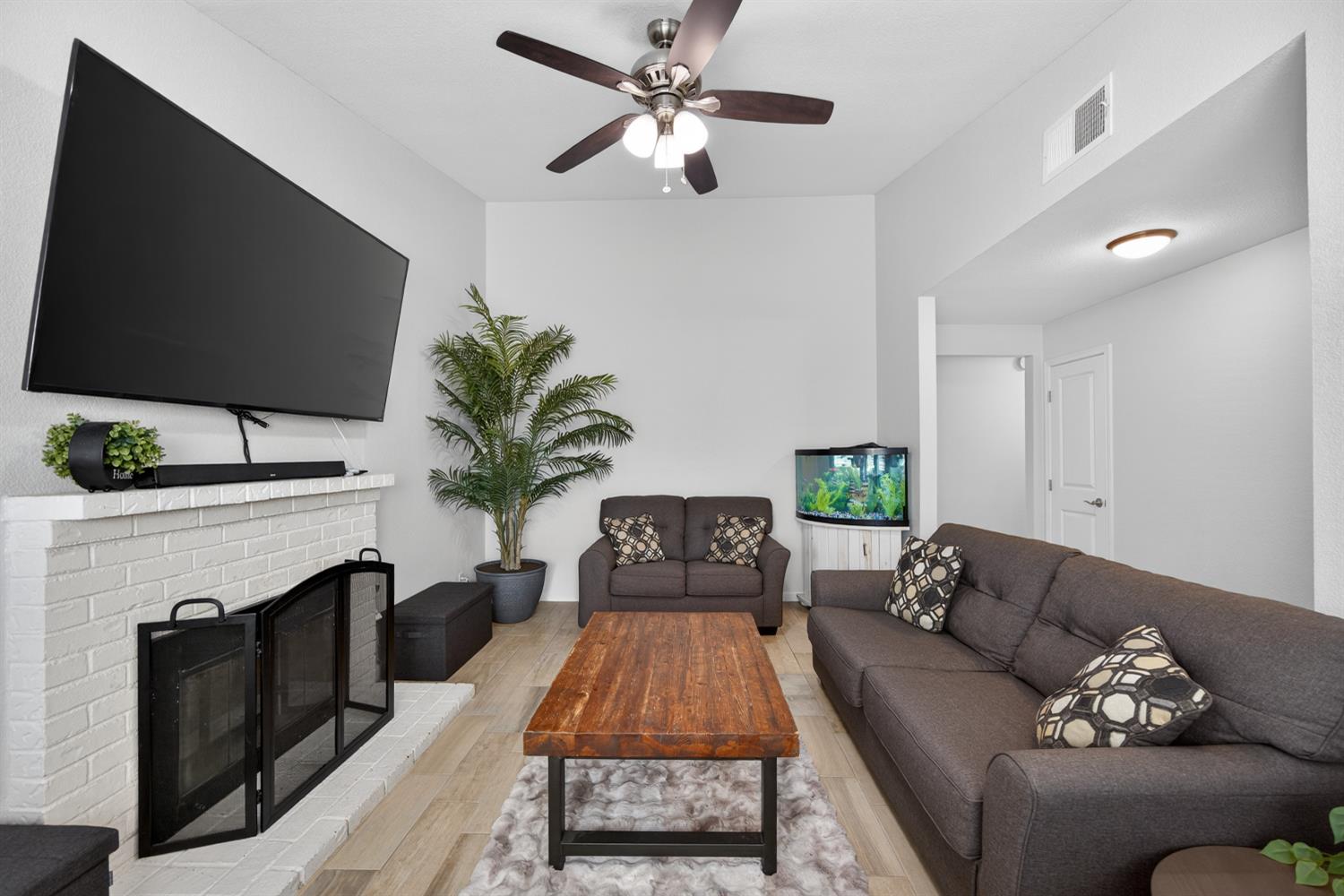 3237 Oriole Way Antelope, CA 95843 - Photo 13 of 47 a living room with furniture a fireplace and a flat screen tv