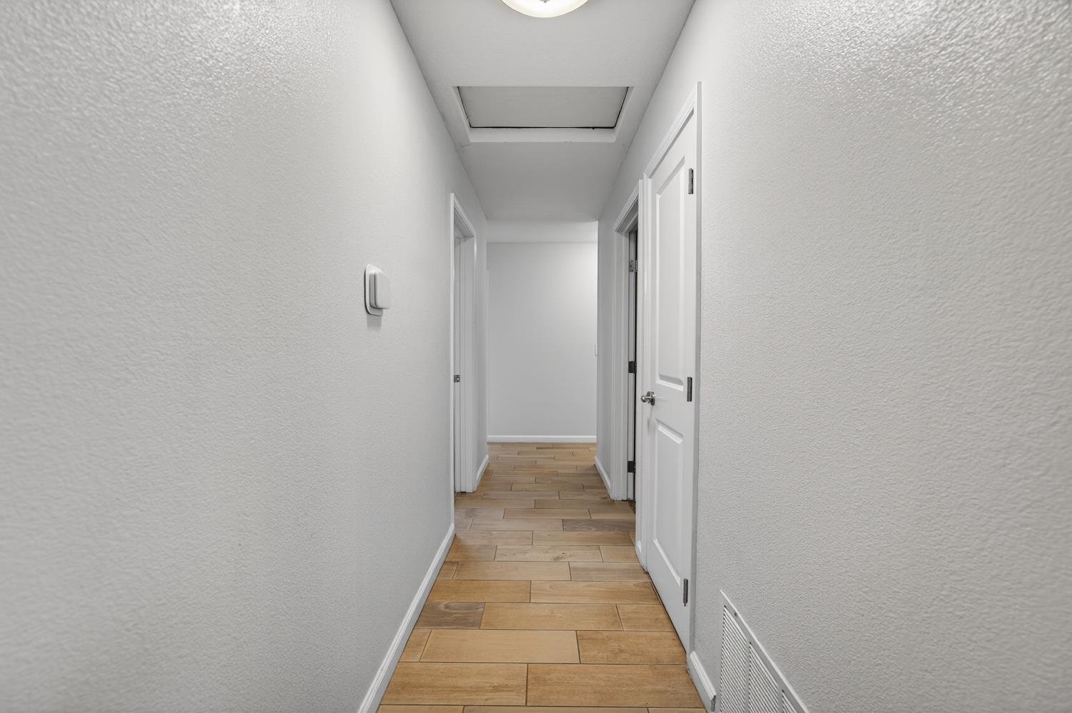 3237 Oriole Way Antelope, CA 95843 - Photo 21 of 47 a view of a hallway with wooden floor and staircase