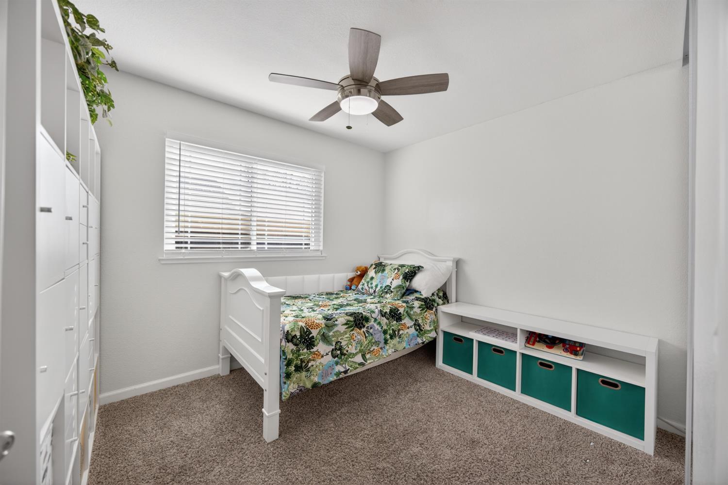 3237 Oriole Way Antelope, CA 95843 - Photo 34 of 47 a bed sitting in a bedroom next to a window