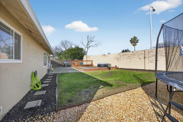 a street view with wooden fence and a bench