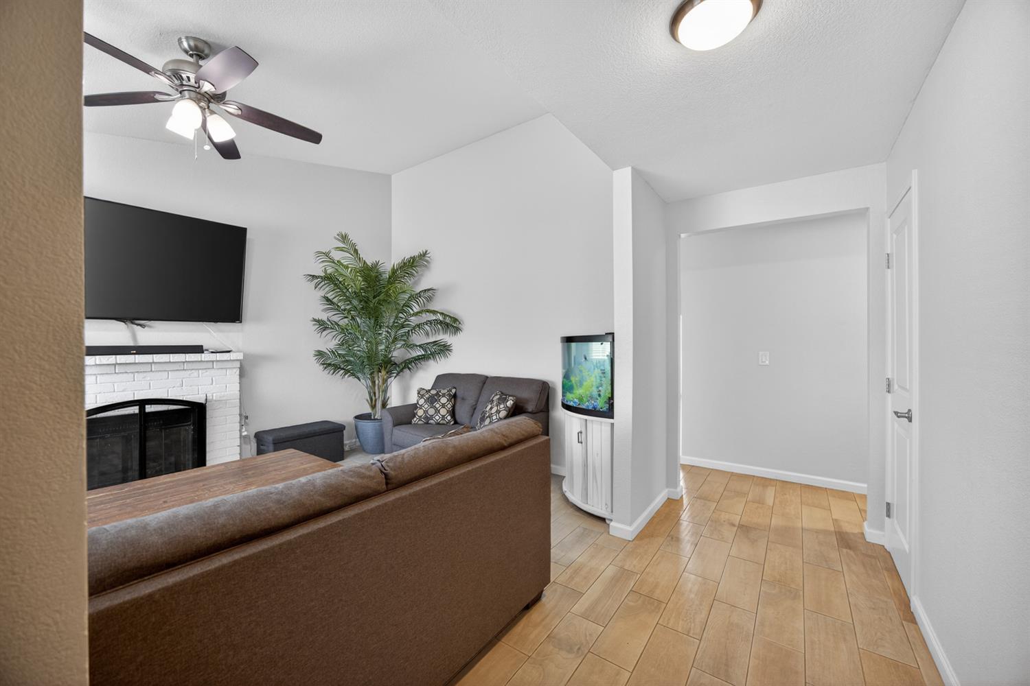 3237 Oriole Way Antelope, CA 95843 - Photo 9 of 47 a living room with furniture a fireplace and a flat screen tv