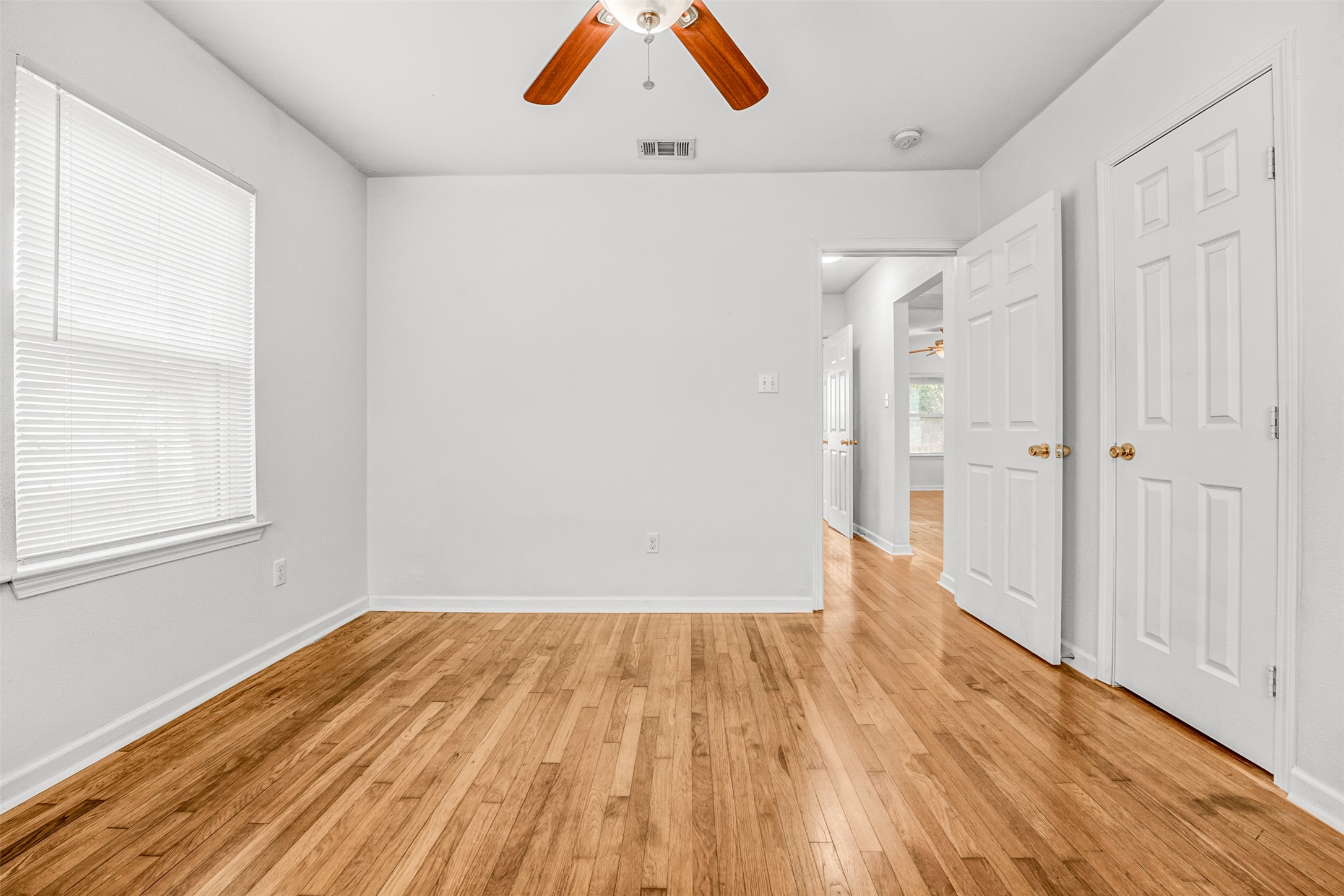 6906 Carver Avenue, Unit A Austin, TX 78752 - Photo 22 of 24 Unfurnished bedroom with light wood-style floors and ceiling fan