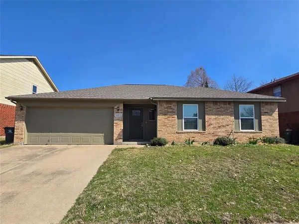 a front view of a house with yard