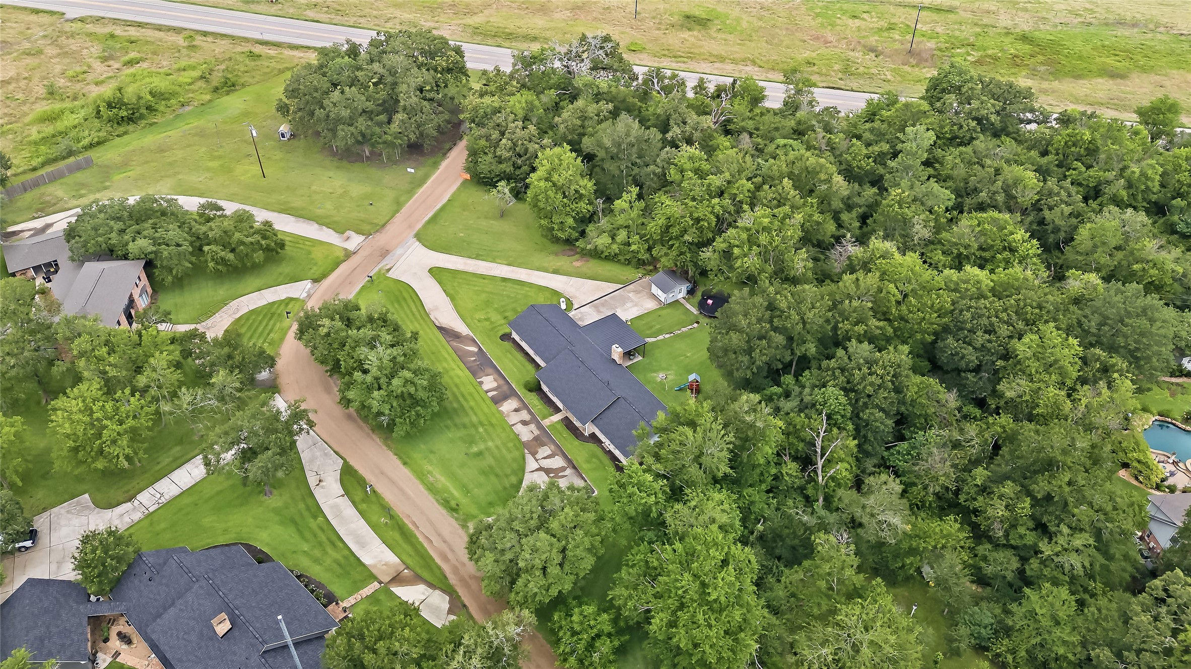 906 Standley Road Madisonville, TX 77864 - Photo 37 of 40 an aerial view of a house with a yard