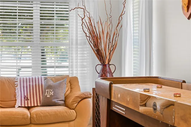 a view of a livingroom with furniture and windows