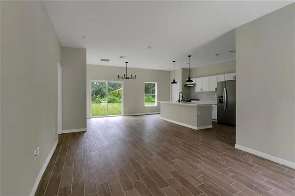 a view of a kitchen cabinets and wooden floor
