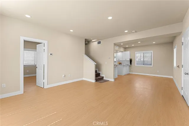 a view of a livingroom with furniture and an entrance