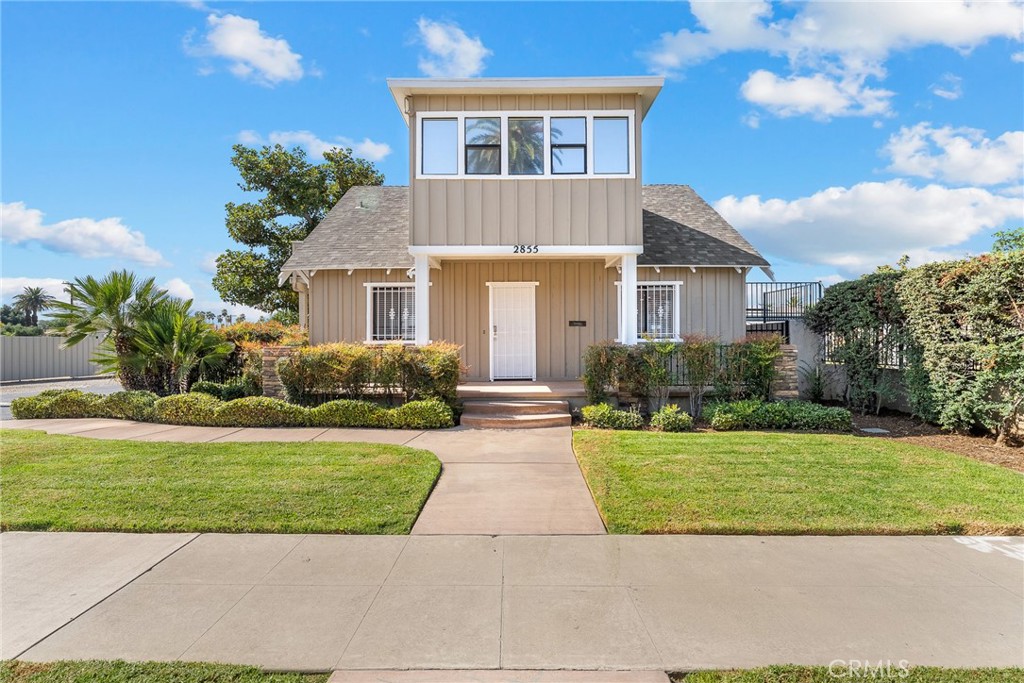 2855 Mulberry Street Riverside, CA 92501 - Photo 2 of 43 a front view of a house with a yard and potted plants