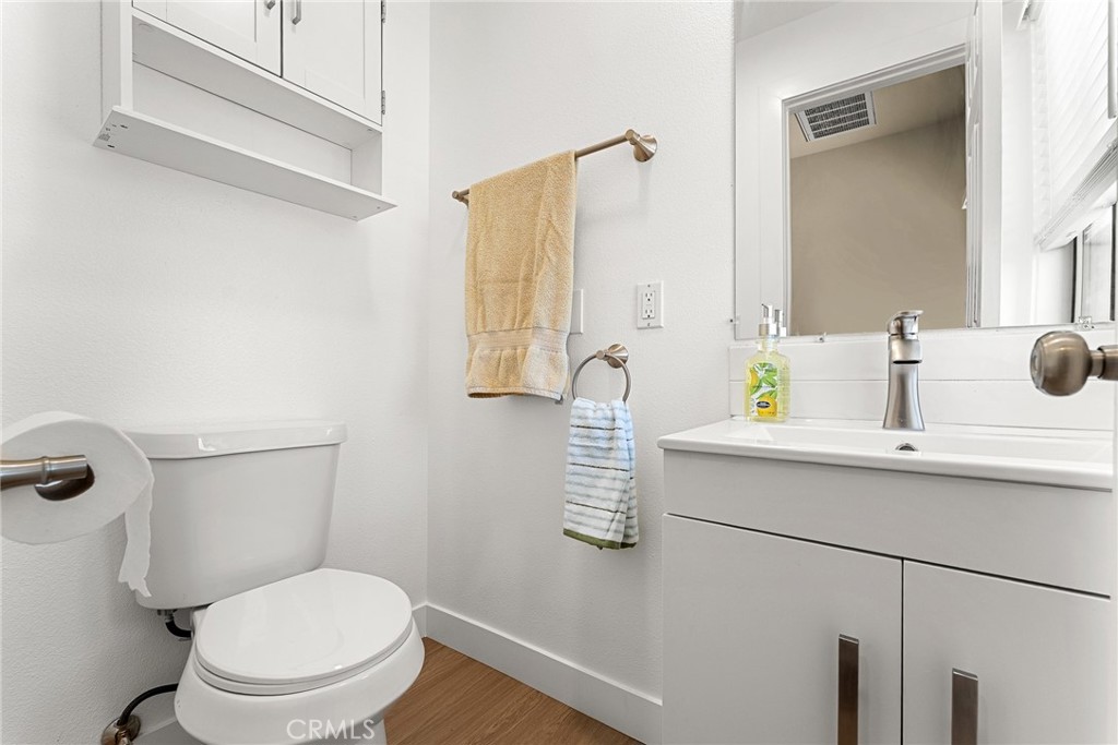 2855 Mulberry Street Riverside, CA 92501 - Photo 21 of 43 a bathroom with a sink toilet and mirror