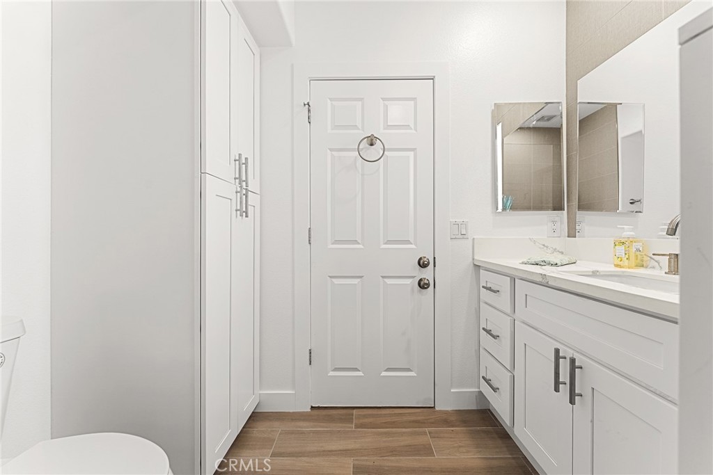 2855 Mulberry Street Riverside, CA 92501 - Photo 24 of 43 a bathroom with a sink and mirror with toilet