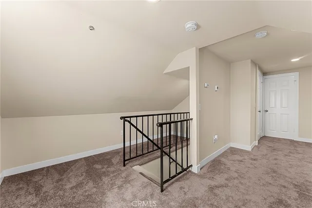 an empty room with staircase