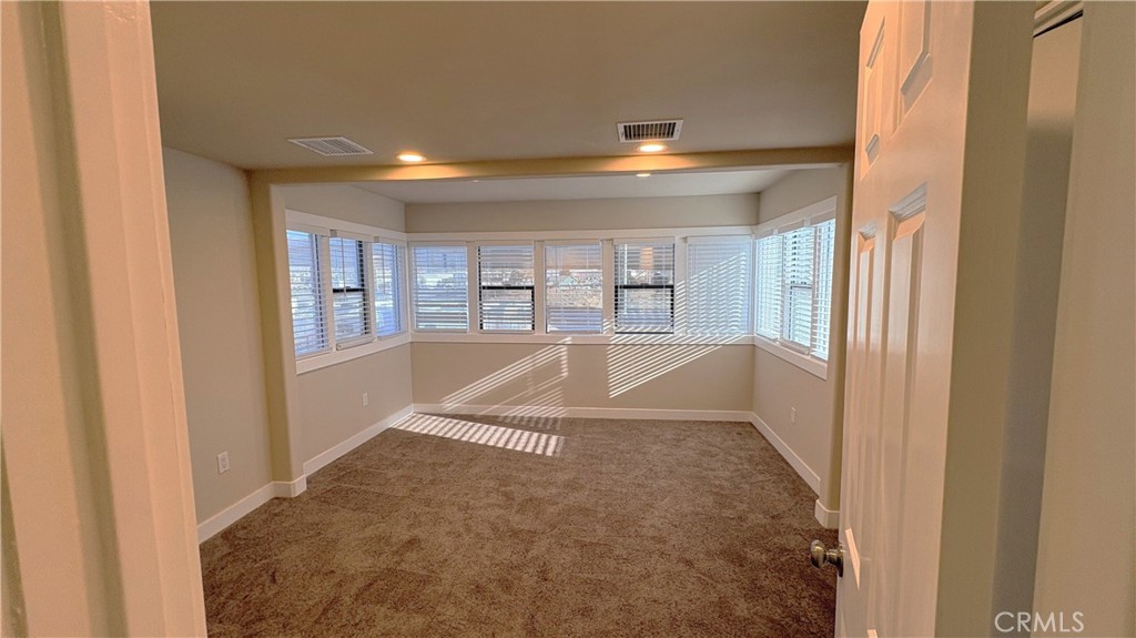 2855 Mulberry Street Riverside, CA 92501 - Photo 28 of 43 a view of empty room with wooden floor and windows