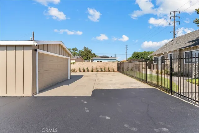 a view of a wrought iron fences in front of house
