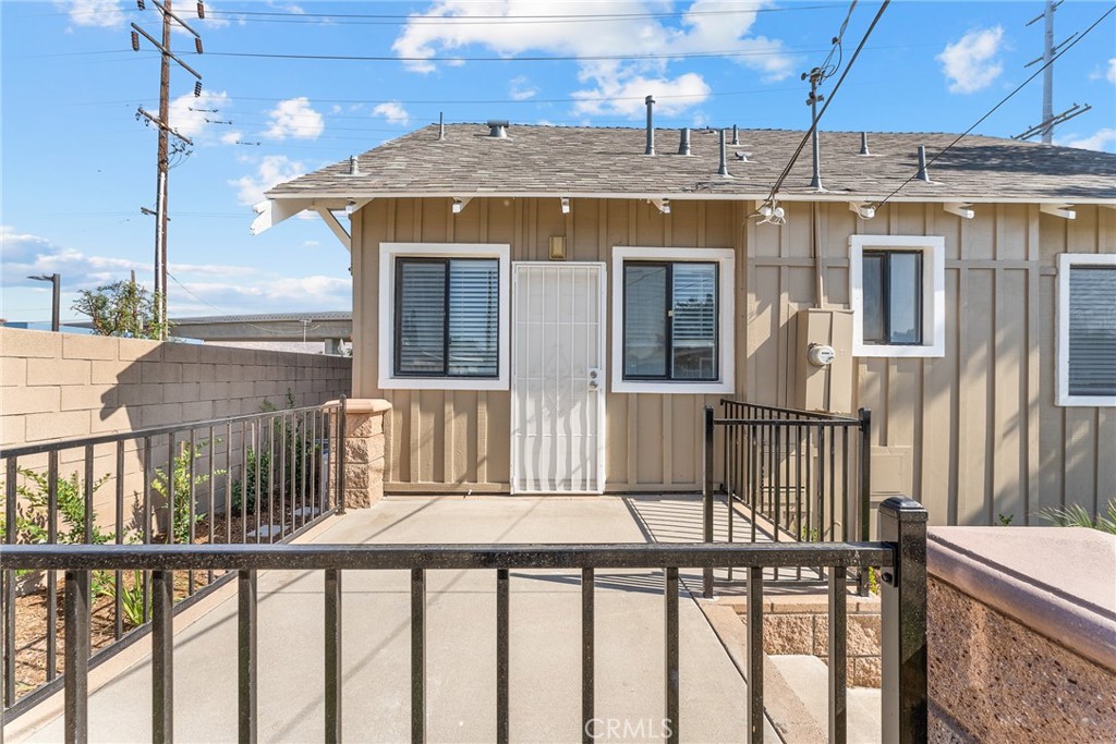 2855 Mulberry Street Riverside, CA 92501 - Photo 40 of 43 a view of a brick house with a wooden fence