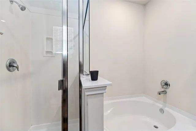 a bathroom with a bathtub and a sink