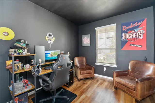 a work room with furniture and a window