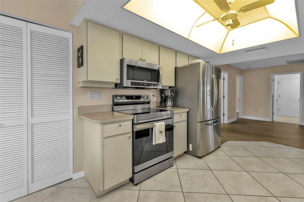 820 Bal Harbor Boulevard Punta Gorda, FL 33950 - Photo 13 of 56 a kitchen with stainless steel appliances granite countertop a refrigerator a stove and a sink