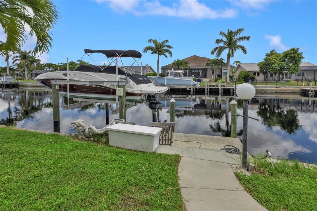 820 Bal Harbor Boulevard Punta Gorda, FL 33950 - Photo 26 of 56 a view of a patio with table and chairs potted plants