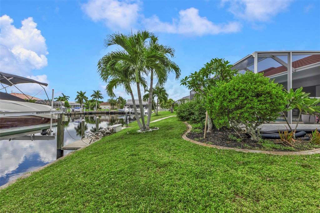 820 Bal Harbor Boulevard Punta Gorda, FL 33950 - Photo 28 of 56 a view of a backyard with plants and lake view