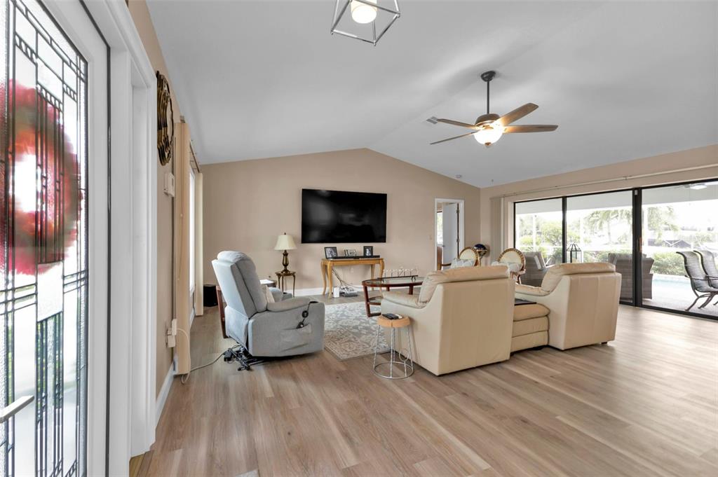 820 Bal Harbor Boulevard Punta Gorda, FL 33950 - Photo 29 of 56 a living room with fireplace furniture and a flat screen tv