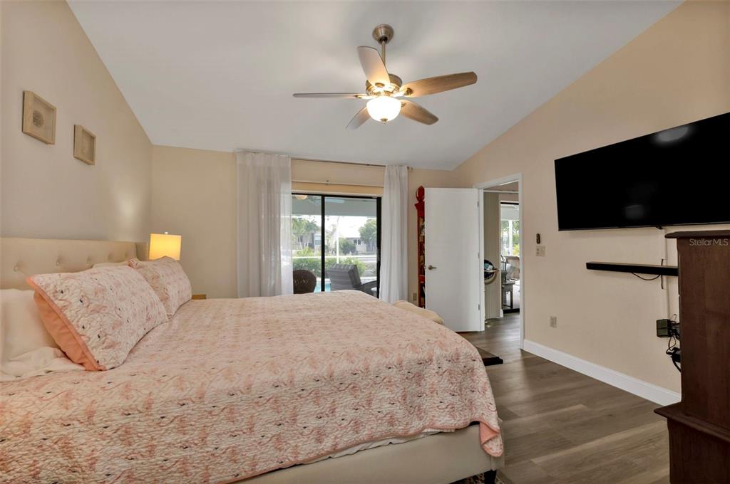 820 Bal Harbor Boulevard Punta Gorda, FL 33950 - Photo 37 of 56 a bedroom with a bed and a flat screen tv