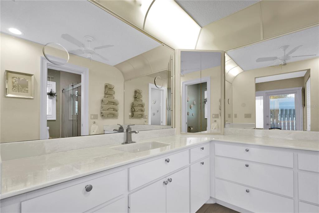 820 Bal Harbor Boulevard Punta Gorda, FL 33950 - Photo 38 of 56 a bathroom with double vanity sinks a mirror a double vanity