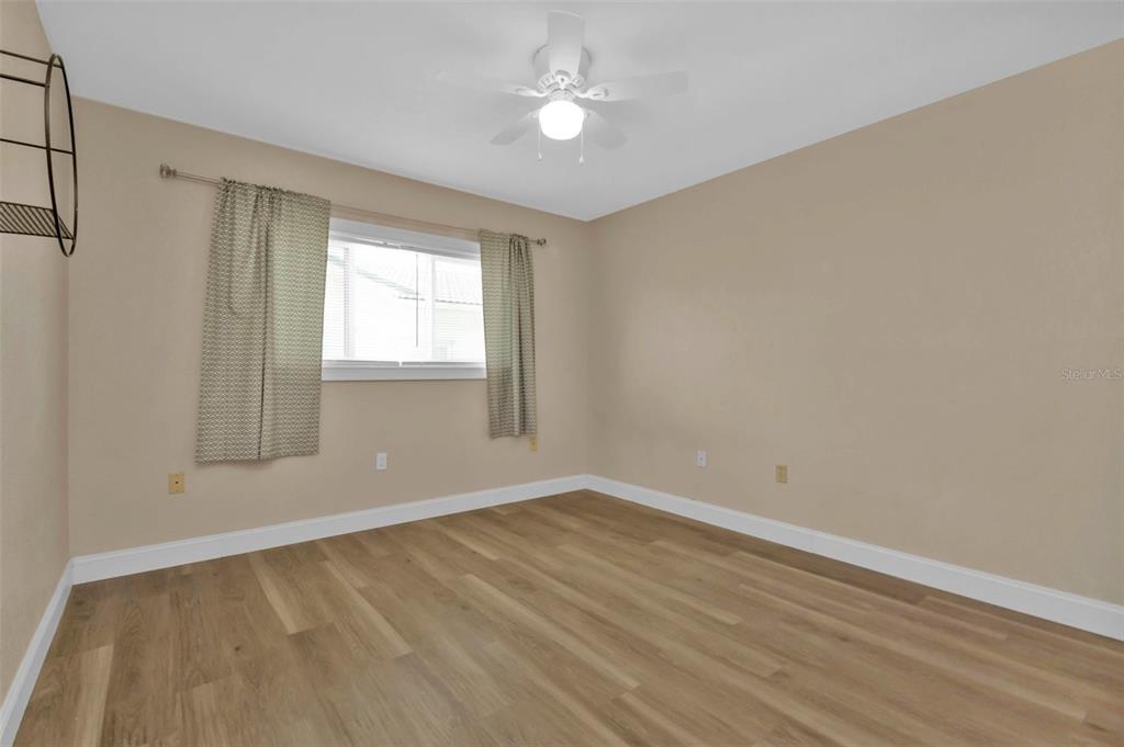 820 Bal Harbor Boulevard Punta Gorda, FL 33950 - Photo 46 of 56 wooden floor in an empty room with a window