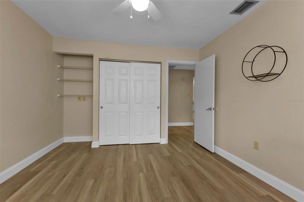 820 Bal Harbor Boulevard Punta Gorda, FL 33950 - Photo 48 of 56 an empty room with wooden floor and white walls