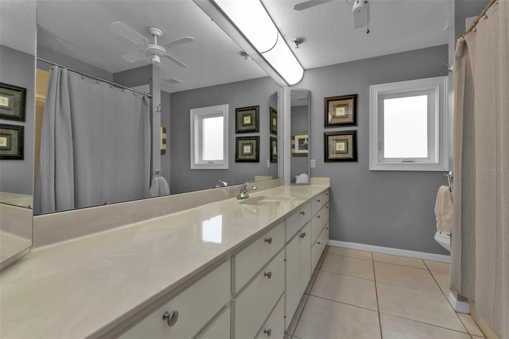 820 Bal Harbor Boulevard Punta Gorda, FL 33950 - Photo 49 of 56 a bathroom with a granite countertop sink mirror and double