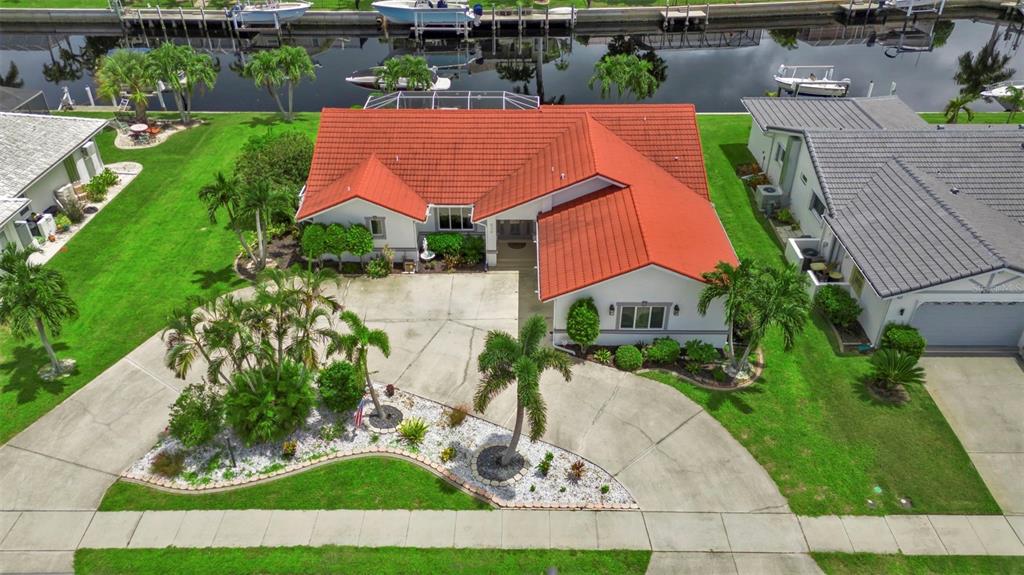 820 Bal Harbor Boulevard Punta Gorda, FL 33950 - Photo 5 of 56 an aerial view of multiple houses with yard